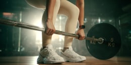 woman doing a deadlift in the gym